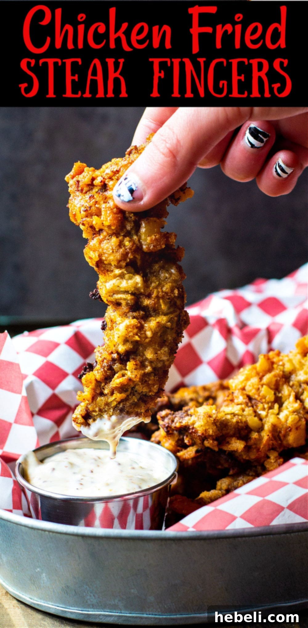 A large platter filled with golden brown Chicken Fried Steak Fingers and a bowl of Creole Mustard Sauce, ready to be served.