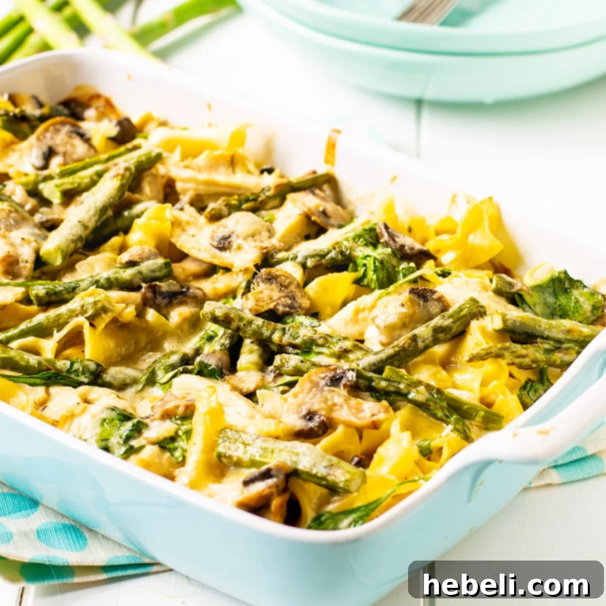 Hearty Chicken and Asparagus Bake 2 A delicious creamy Chicken and Asparagus Casserole in a baking dish, ready to be served.