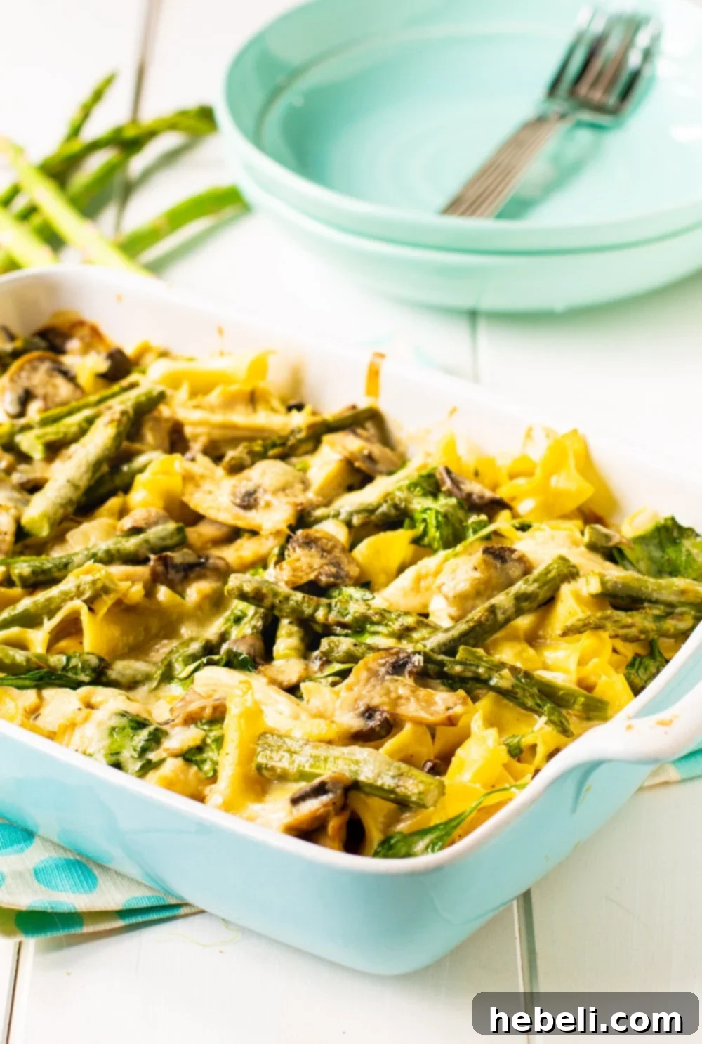 Hearty Chicken and Asparagus Bake 3 Close-up of the Chicken Casserole with fresh asparagus and mushrooms, glistening with creamy sauce.