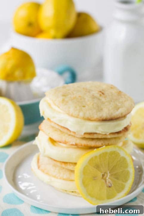 Zesty Lemon Whoopie Pies 3 Close-up of a Lemon Whoopie Pie, showing the delicate cookie texture and generous cream cheese filling.