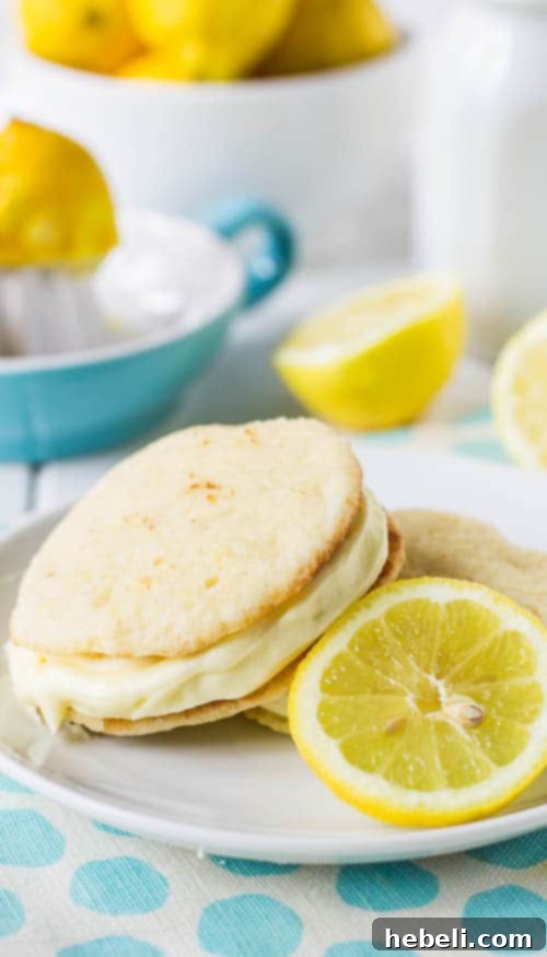Zesty Lemon Whoopie Pies 4 A plate of freshly baked Lemon Whoopie Pies, showcasing their golden-yellow hue and inviting appearance.