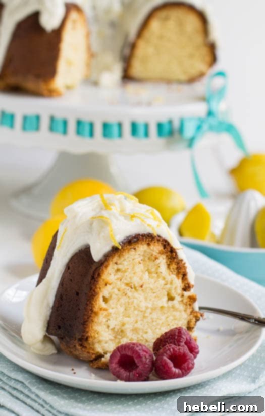 A beautifully sliced Lemon Cream Cheese Pound Cake, revealing its moist and tender crumb, perfect for serving.