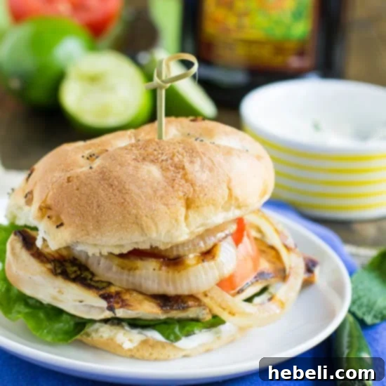 Fresh Mojito Chicken Sandwiches 3 Close-up of a single Mojito Chicken Sandwich, showcasing the grilled chicken, fresh toppings, and creamy sauce.