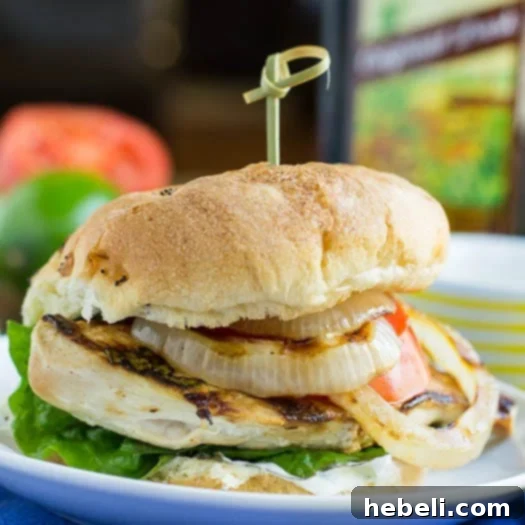 Fresh Mojito Chicken Sandwiches 5 A vibrant platter of Mojito Chicken Sandwiches, garnished with fresh mint and lime wedges.