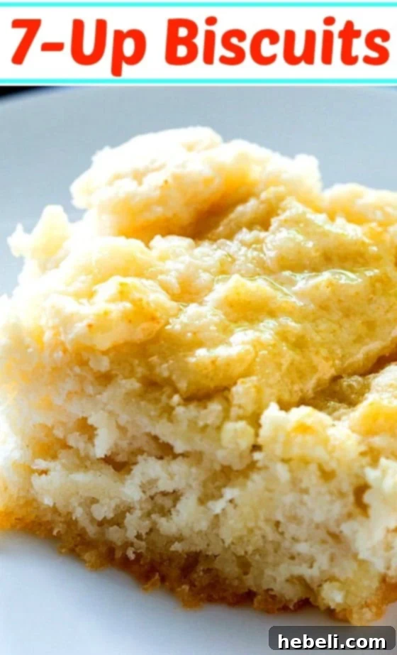 Close-up of a perfectly baked, fluffy 7-Up Biscuit, showing its tender layers