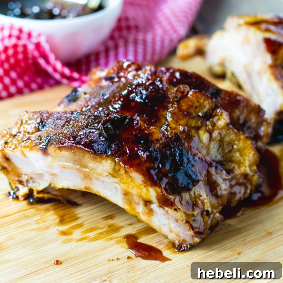 A generous serving of Jack Daniel's Ribs on a rustic cutting board, garnished for presentation.