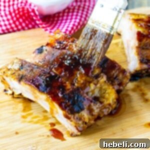 Brushing sauce on Jack Daniels Ribs