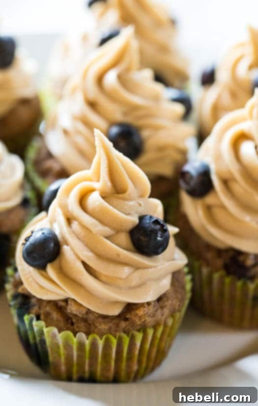 Luscious Blueberry Maple Cupcakes 2 Delicious Blueberry Maple Cupcakes with creamy maple frosting and fresh berries
