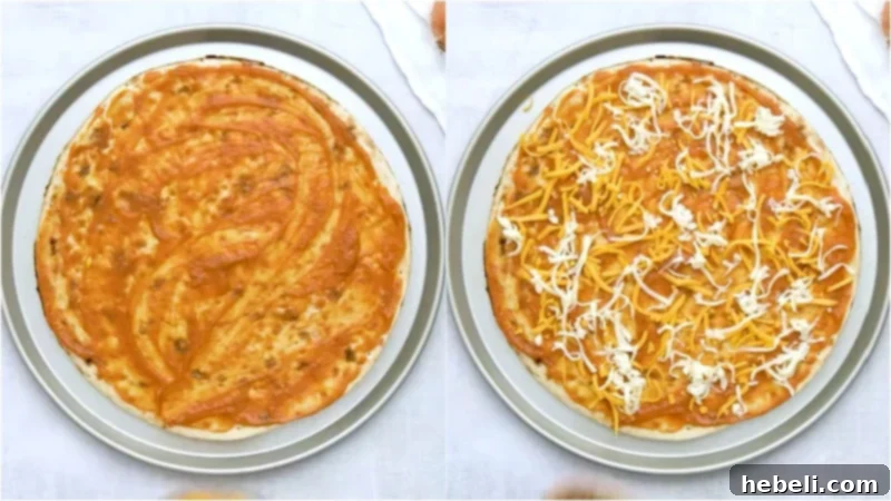 Pizza crust with a thin layer of sauce and a sprinkle of cheddar and mozzarella cheese.