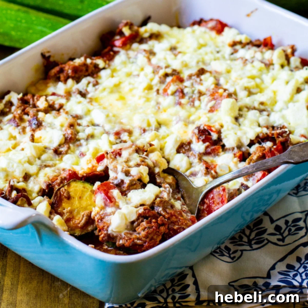 Creamy Zucchini Moussaka 2 A delectable Zucchini Moussaka in a casserole dish, ready to be served.
