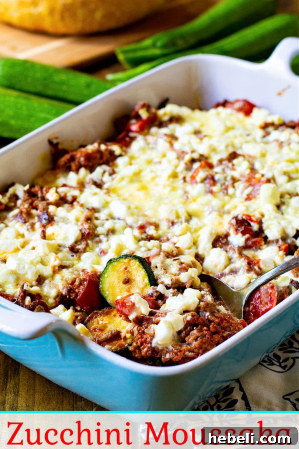 Creamy Zucchini Moussaka 6 Close-up of Zucchini Moussaka, showcasing sautéed zucchini, meat sauce, and a generous topping of feta cheese.