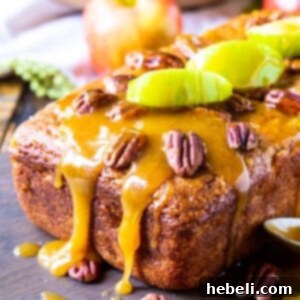 Caramel Apple Bread topped with apple slices and pecans.