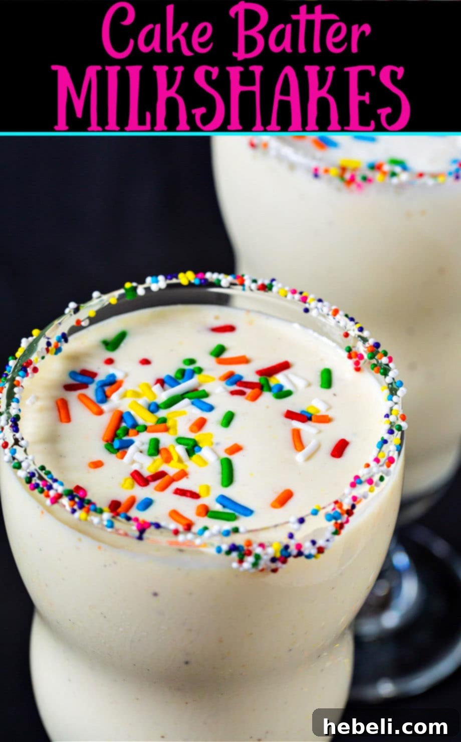 A vibrant Cake Batter Milkshake topped with whipped cream and sprinkles in a tall glass.