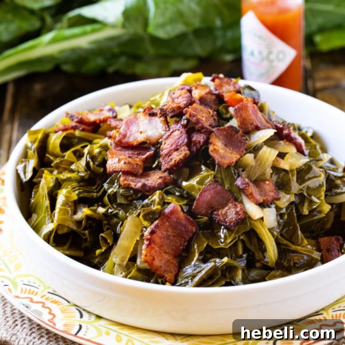 Kickin Collard Greens 2 Spicy Collard Greens topped with crispy bacon in a white bowl, ready to be served.