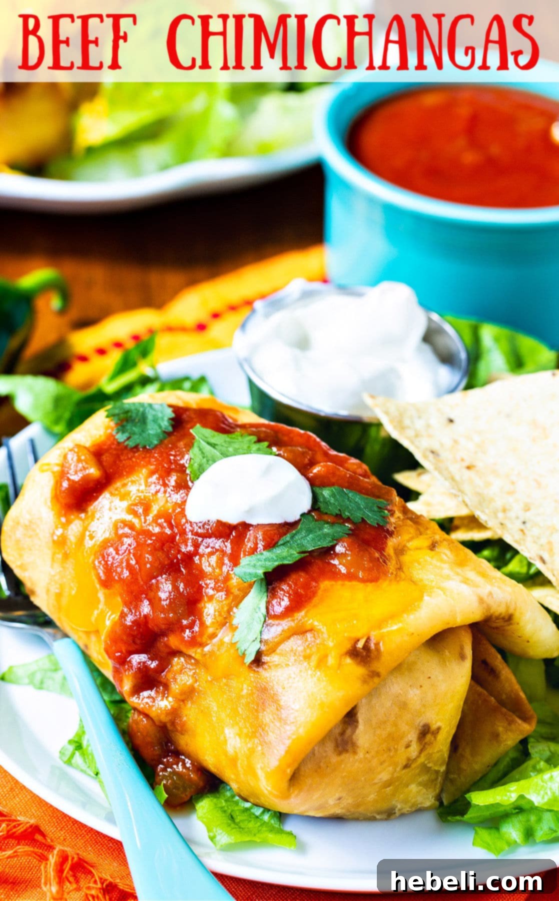 Crispy Beef Chimichangas 6 A delicious Beef Chimichanga ready to be served, topped with cheese and sauce.