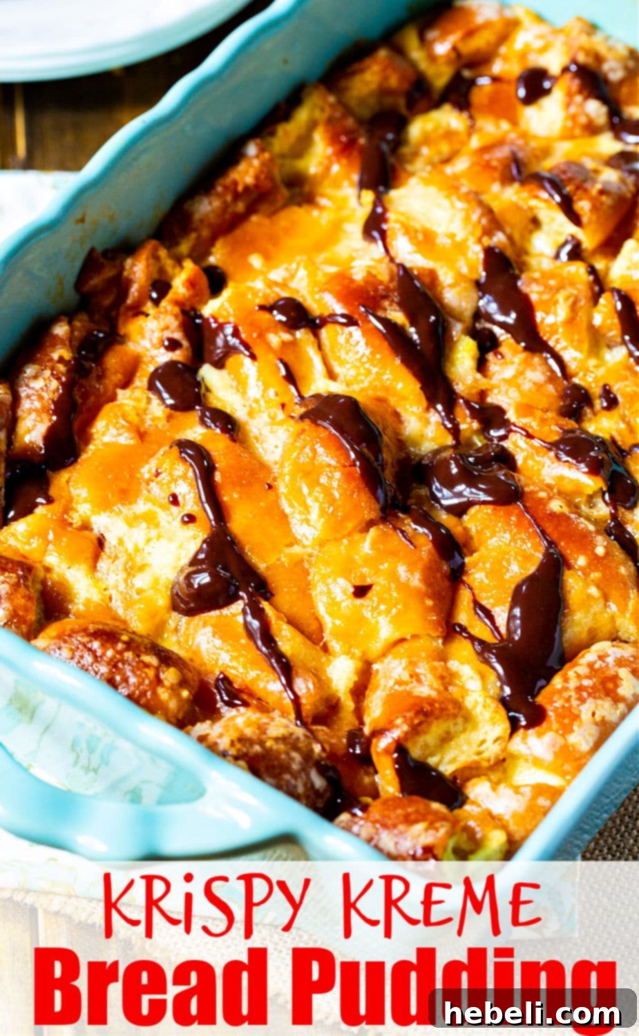 Warm bread pudding topped generously with homemade chocolate sauce.