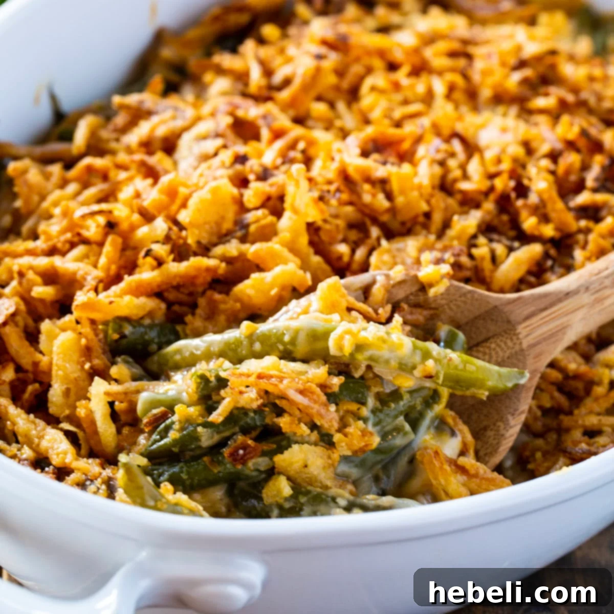 Mouthwatering Cheesy Green Bean Bake 2 A golden-brown Cheesy Green Bean Casserole in a baking dish, ready to be served.