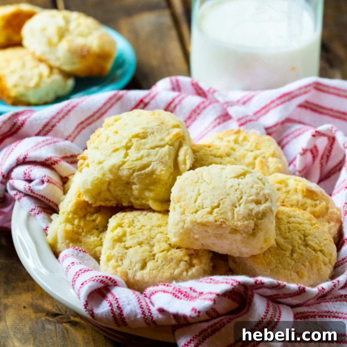 Callie's Fluffy Buttermilk Biscuits 2 Freshly baked Callie's Buttermilk Biscuits in a rustic bread bowl, golden brown and ready to serve.