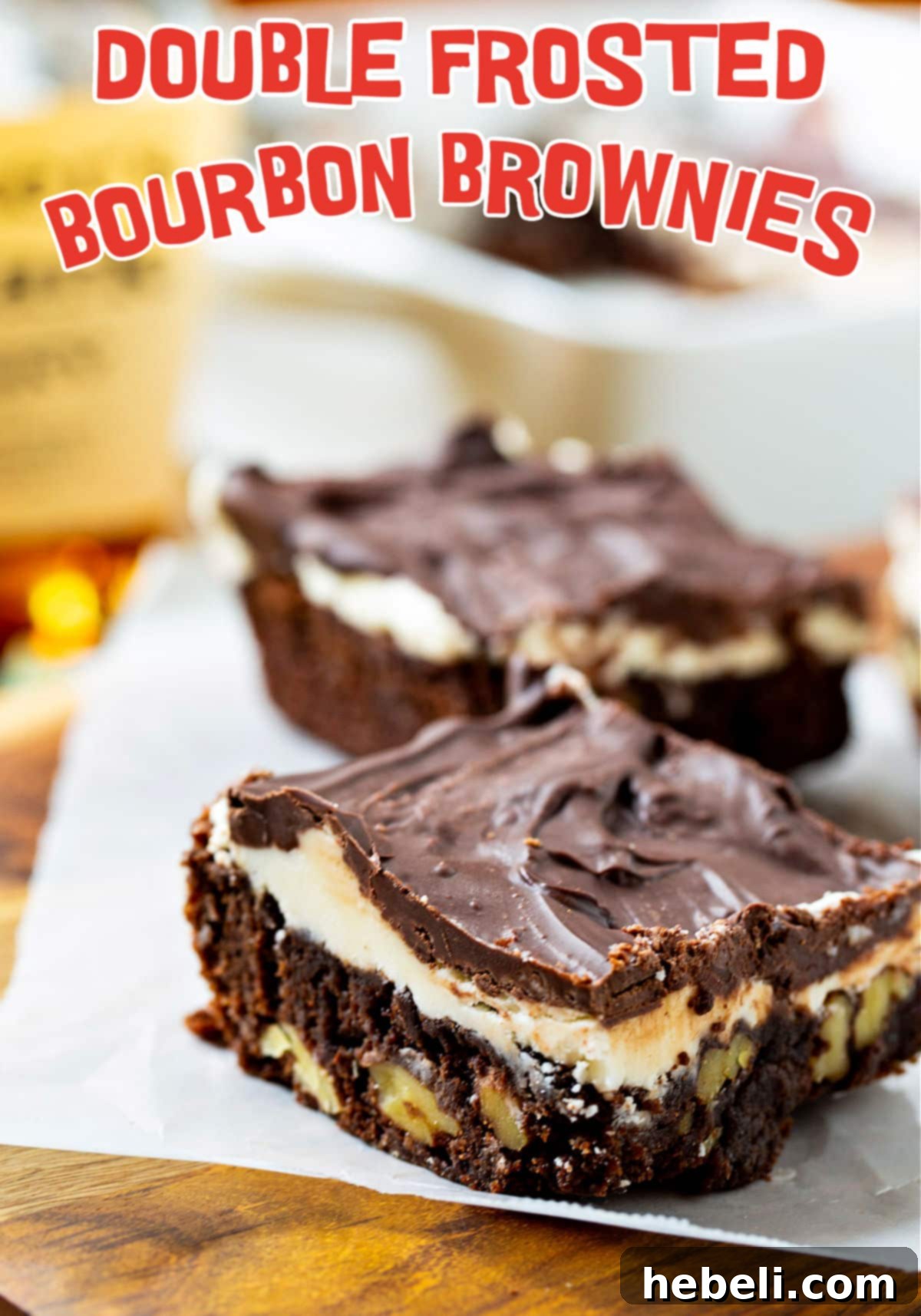 Close-up shot of a single Double Frosted Bourbon Brownie, showing its rich texture, walnuts, and glossy chocolate glaze over white icing.