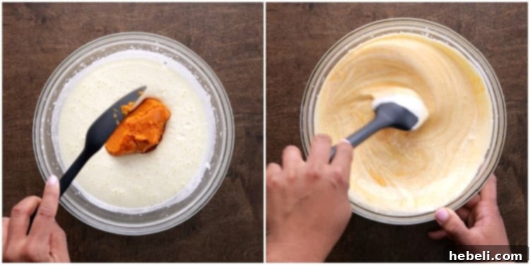 Gently mixing pumpkin puree and lemon juice into the lightened egg and sugar mixture with a spatula.
