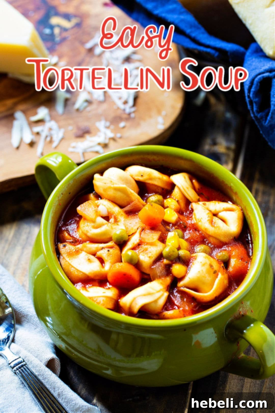 A close-up shot of a bowl brimming with Easy Tortellini Soup, garnished and ready to eat.