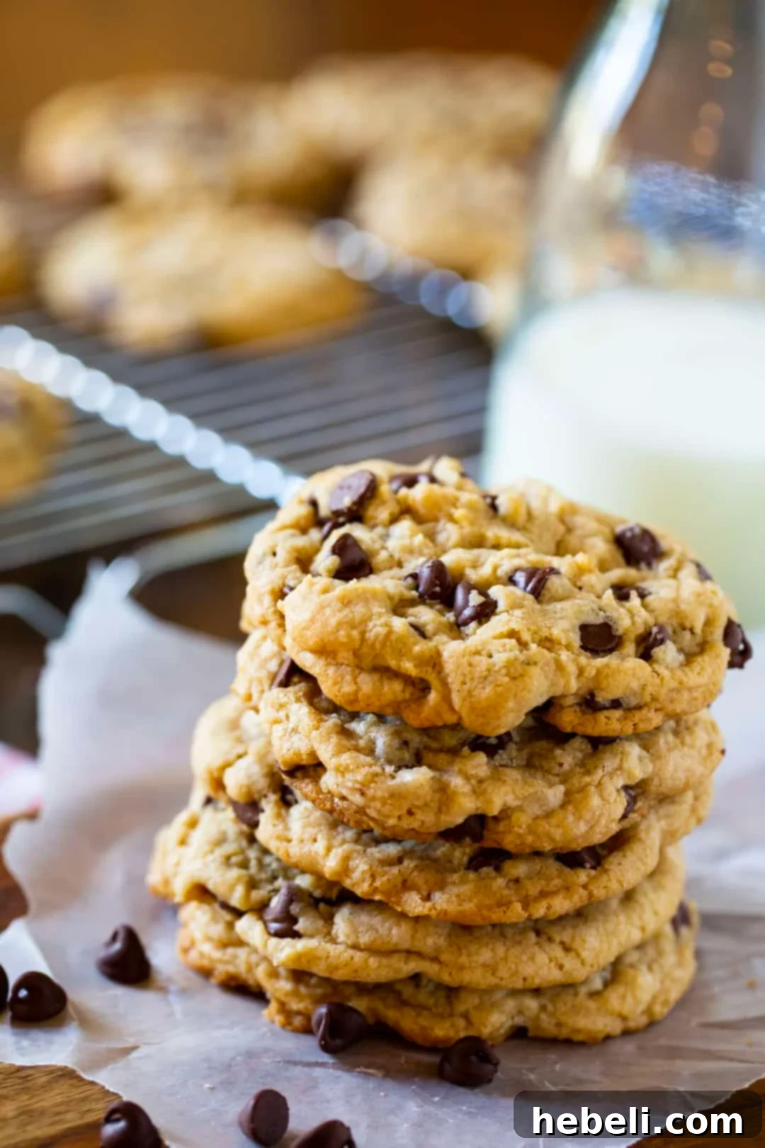 Perfectly Chewy Chocolate Chip Cookies 4 Close-up of a stack of chewy chocolate chip cookies, highlighting their perfect texture, generous chocolate content, and inviting golden-brown crust.
