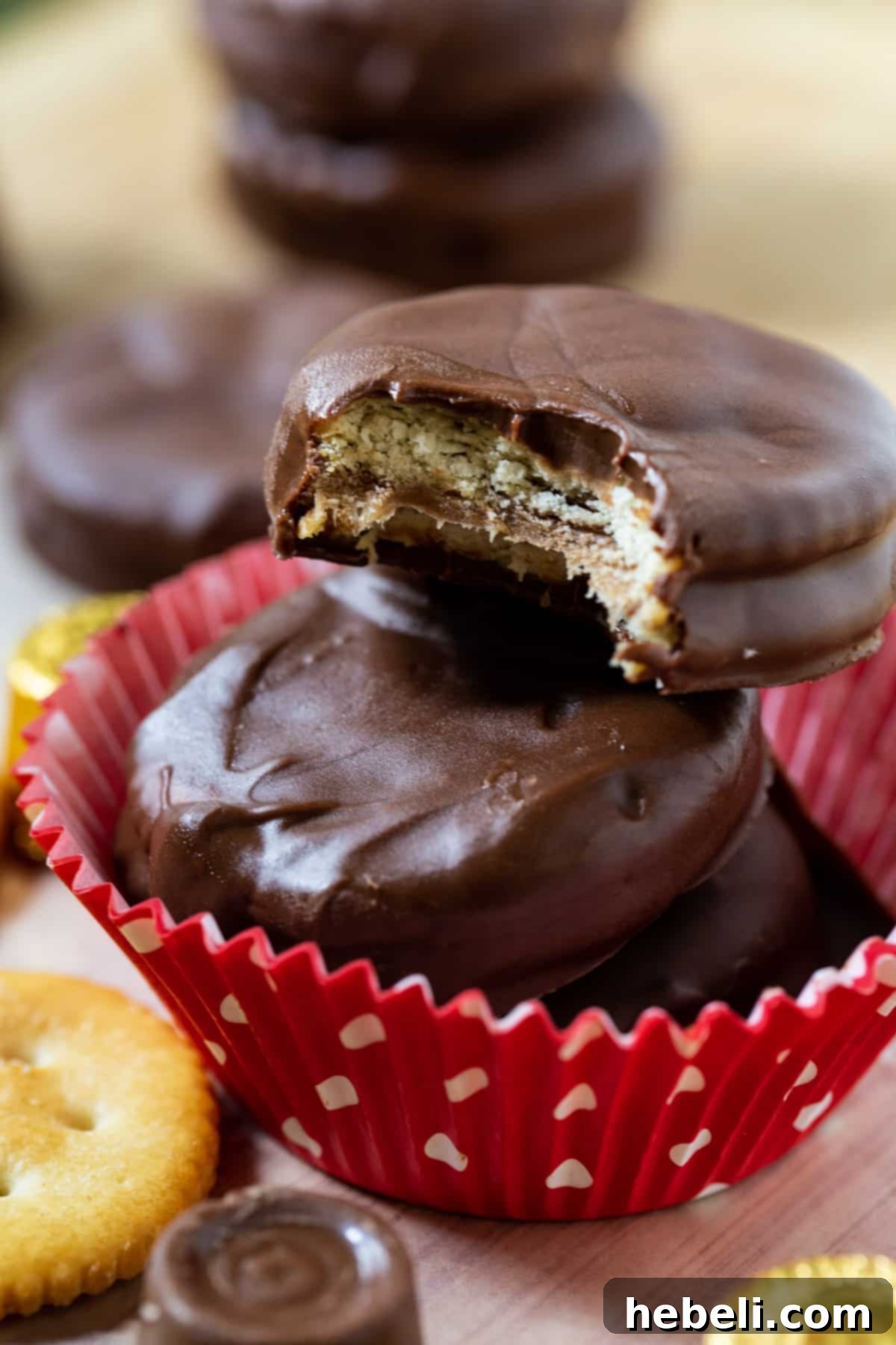 Rolo Ritz Caramel Delights 3 A Rolo Stuffed Ritz Cracker with a bite taken out, revealing the soft, gooey caramel filling and crispy cracker layers.