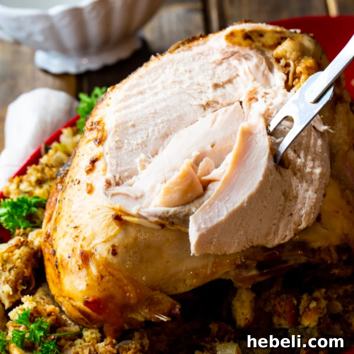 Juicy Slow Cooker Turkey Breast 2 Expertly carved Crock Pot Turkey Breast, revealing its tender, juicy interior.