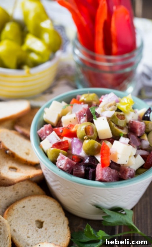 French Onion and Muffaletta Dips 11 Muffaletta Dip featuring salami, cheese, and olives, an easy and flavorful make-ahead dish