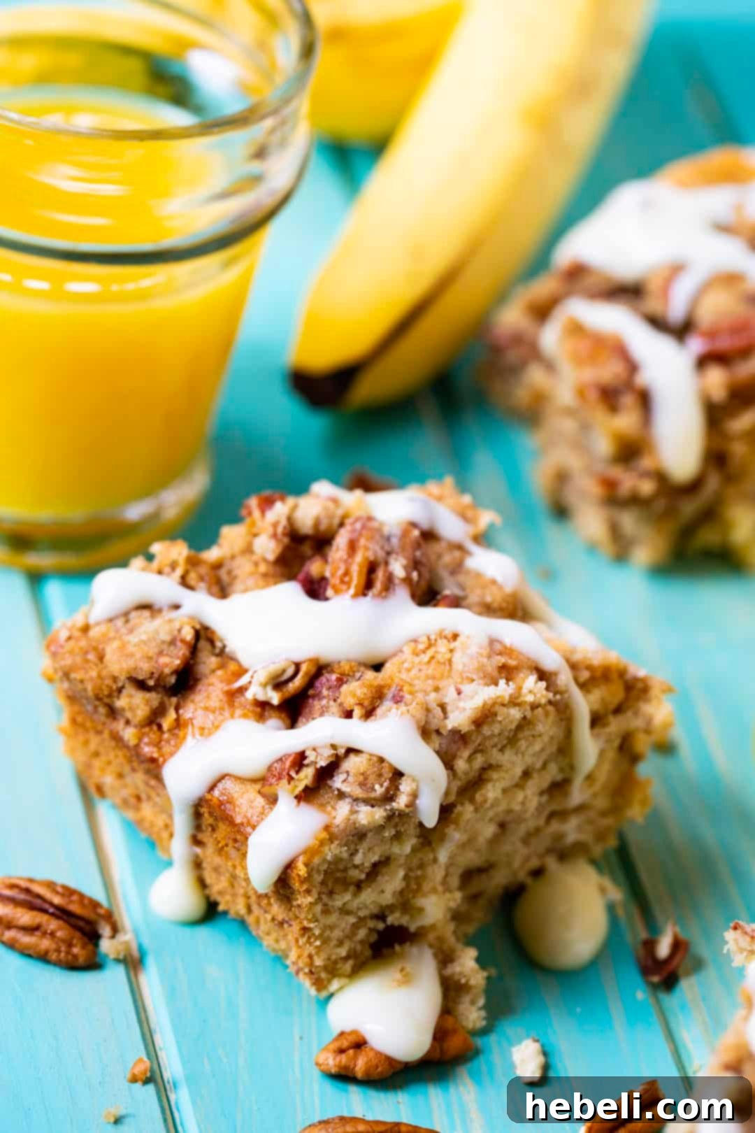Rum Caramel Banana Coffee Cake 3 A slice of Bananas Foster Coffee Cake next to a glass of fresh orange juice, perfect for breakfast.