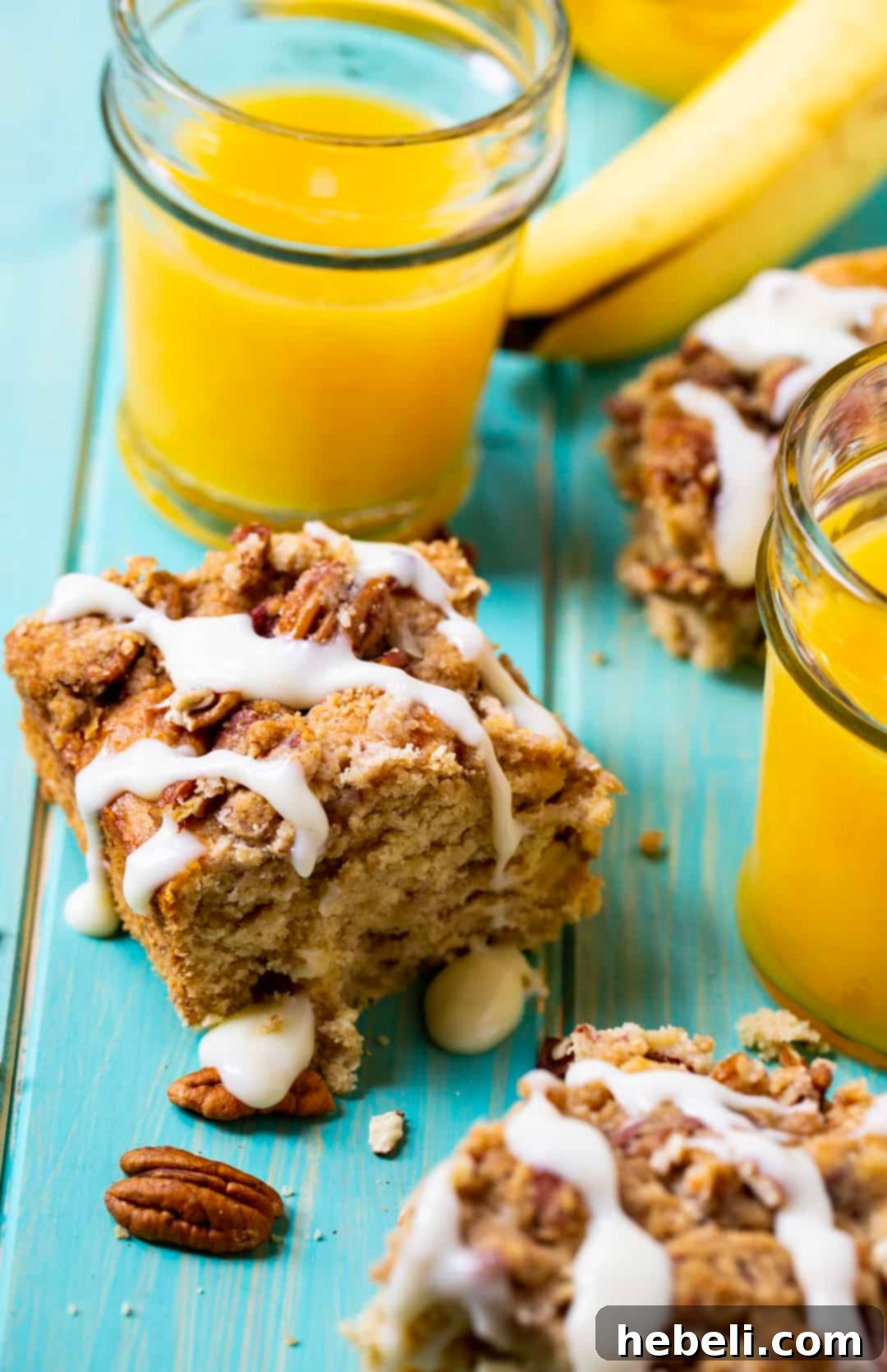 Rum Caramel Banana Coffee Cake 4 Bananas Foster Coffee Cake neatly cut into squares, showcasing its layers.