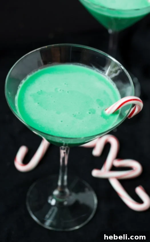 Close-up of a Grasshopper Cocktail being poured from a shaker into a martini glass