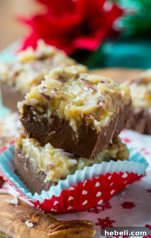Decadent German Chocolate Fudge 8 Multiple pieces of German Chocolate Fudge stacked, showing off its rich texture.