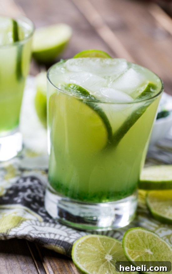 Close-up of a Pepper Jelly Margarita, showcasing its vibrant green color