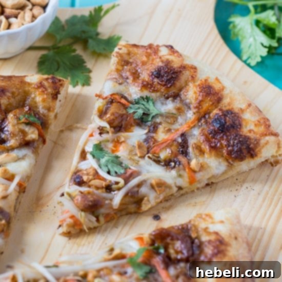 Prepared Thai Chicken Pizza dough with sauce