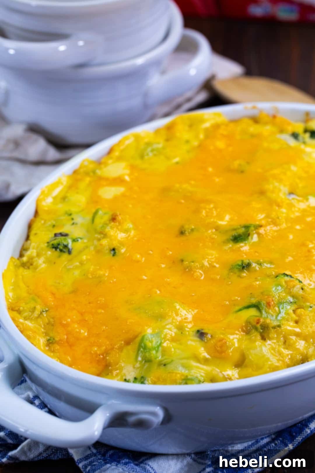 Broccoli casserole in a baking dish, golden brown and bubbly.