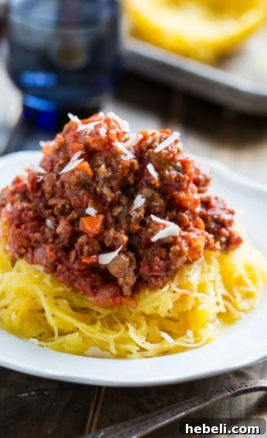 Close-up of Spaghetti Squash with Spicy Meat Sauce, showing the texture of the squash and the chunky meat sauce. #glutenfree #healthy #lowcarb