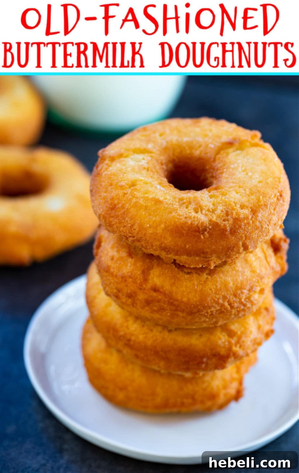 Old-Fashioned Buttermilk Doughnuts stacked beautifully on a plate, ready to be enjoyed.