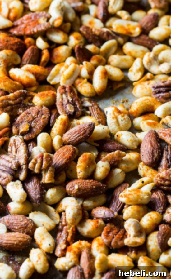 Cajun Nuts - make a great party snack or holiday appetizer. Flavored with plenty of spices, some sugar, and bacon grease for an authentic Southern kick!