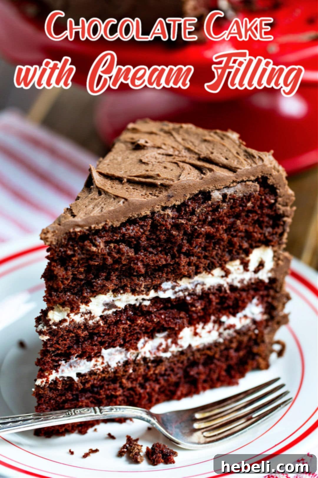 A stunning full view of a sliced Chocolate Cake with Cream Filling on a plate, showcasing its layers and rich appearance.