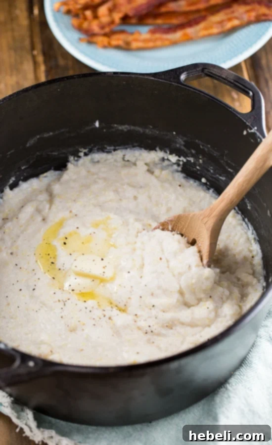 Perfectly cooked, super rich and creamy Cream Cheese Grits, ready to be served.