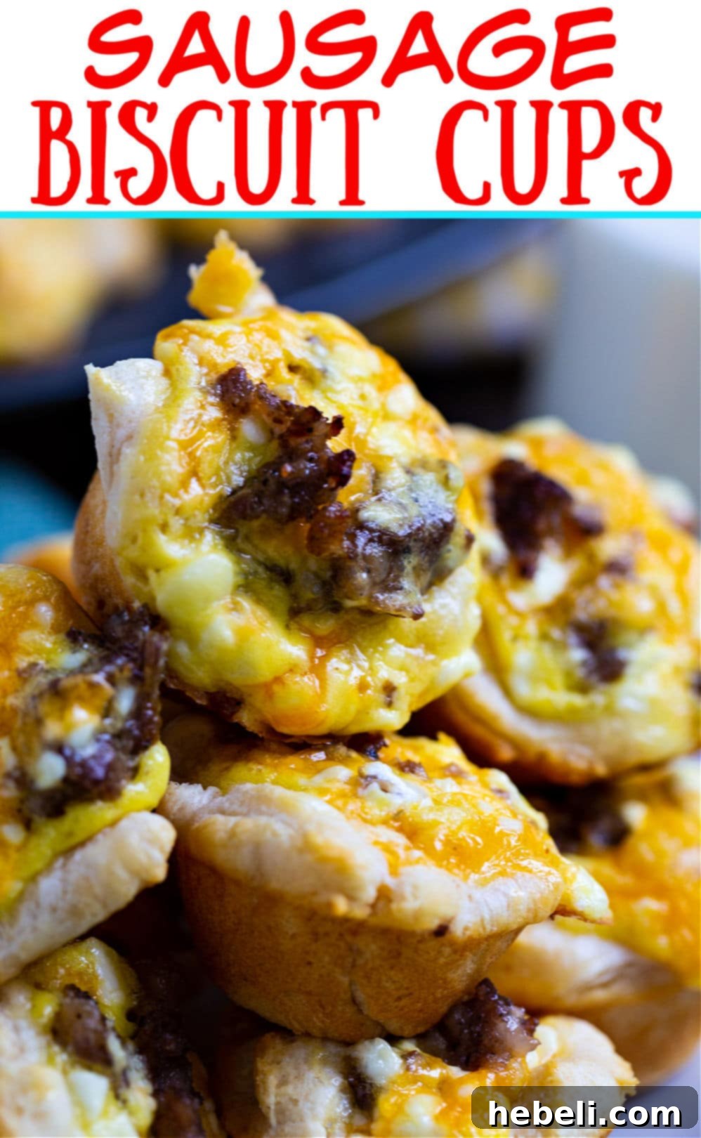 Mini Sausage Biscuit Cups stacked enticingly, showcasing their golden crust and savory filling.