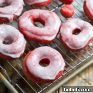 Decadent Red Velvet Glazed Doughnuts 8 A delicious Red Velvet Donut with a smooth glaze, representing the homemade recipe.