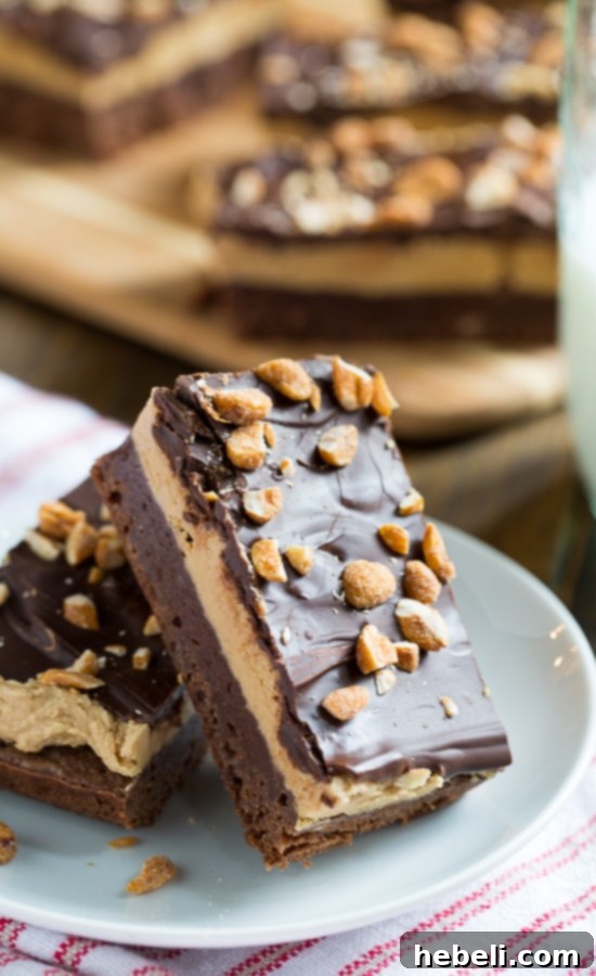Triple Layer Chocolate Peanut Butter Bars with rich peanut butter filling