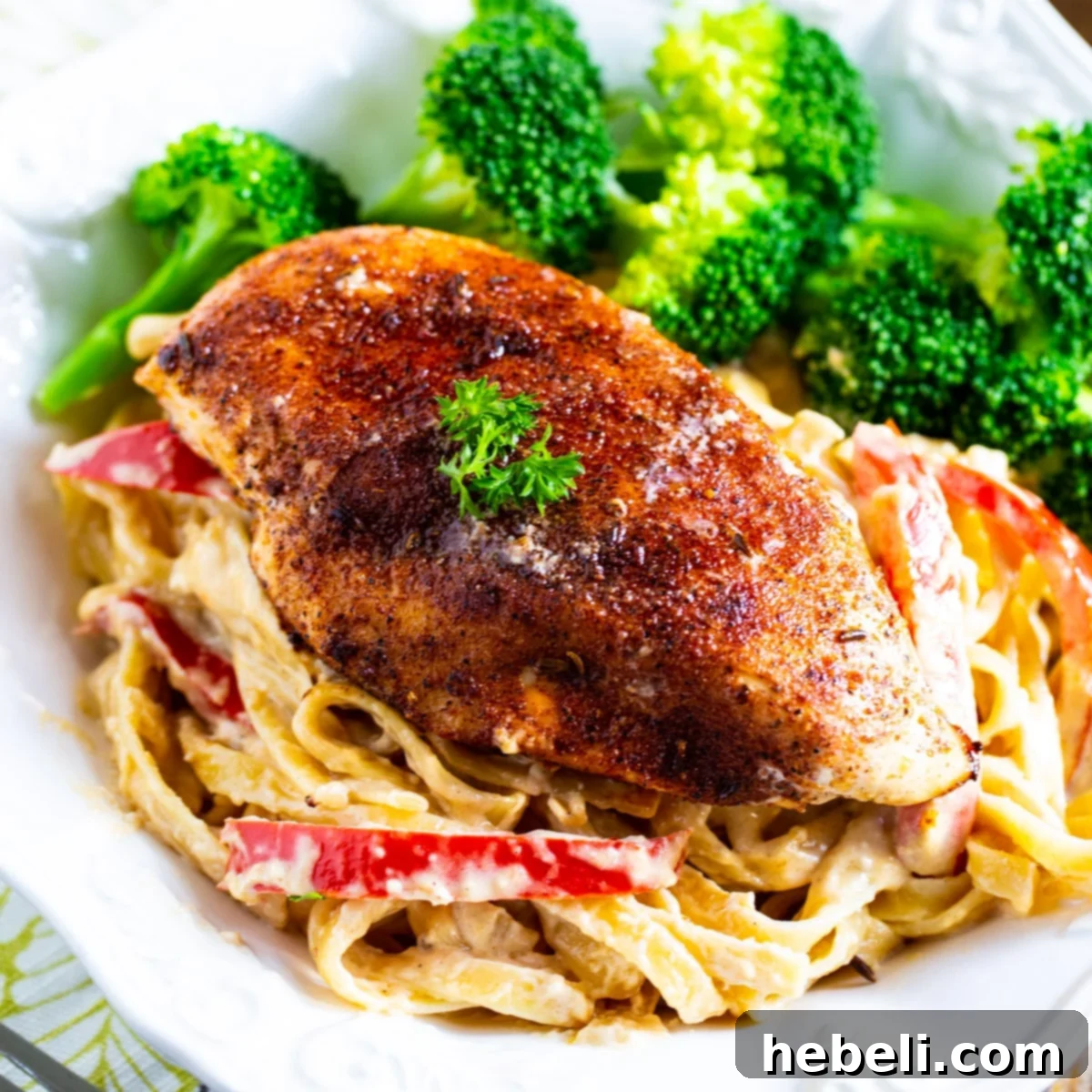 Delicious Blackened Chicken Fettuccine in a pasta bowl, garnished and ready to serve.