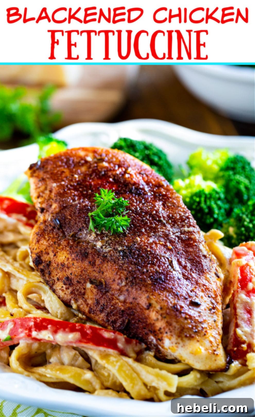 A large serving bowl filled with creamy Blackened Chicken Fettuccine, ready to be dished out.