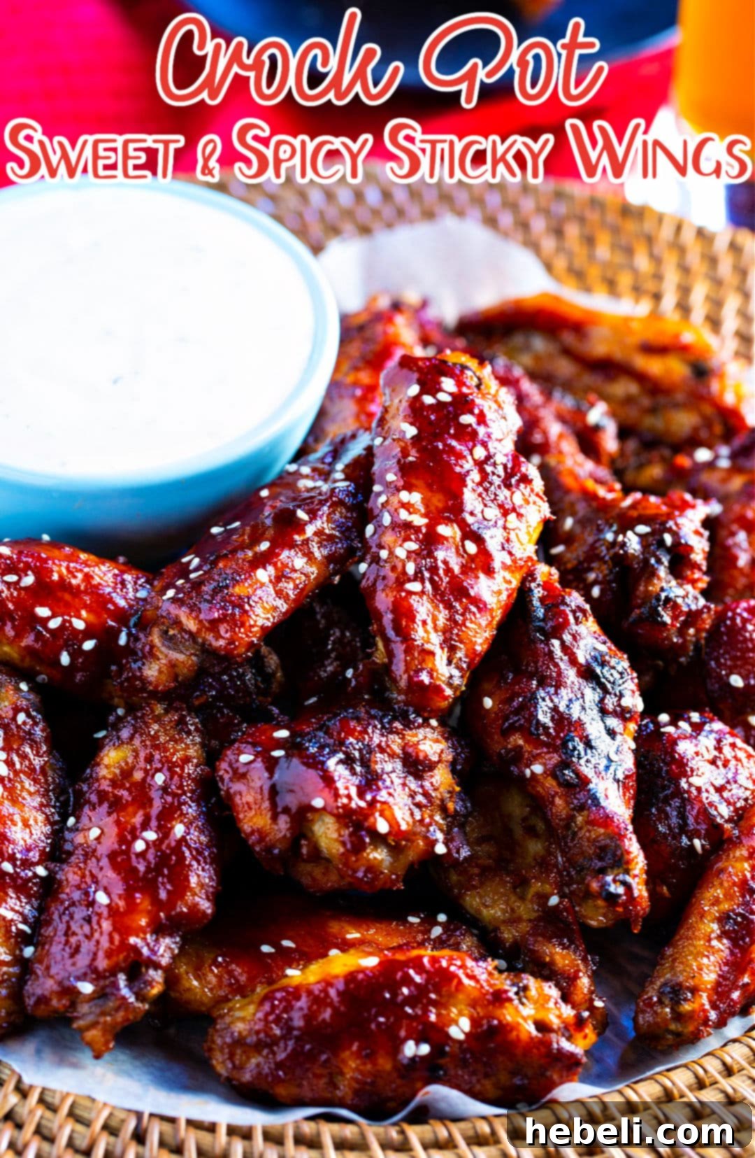 Slow Cooker Sweet Heat Glazed Wings 4 Crock Pot Sweet and Spicy Sticky Wings sprinkled with sesame seeds.