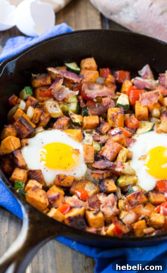 Hearty Sweet Potato Breakfast Hash 3 Sweet Potato Hash - Featuring vibrant sweet potatoes, bell peppers, zucchini, and onion