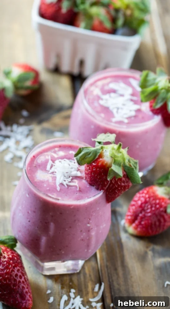 Strawberry Coconut Smoothie with ingredients displayed beside it