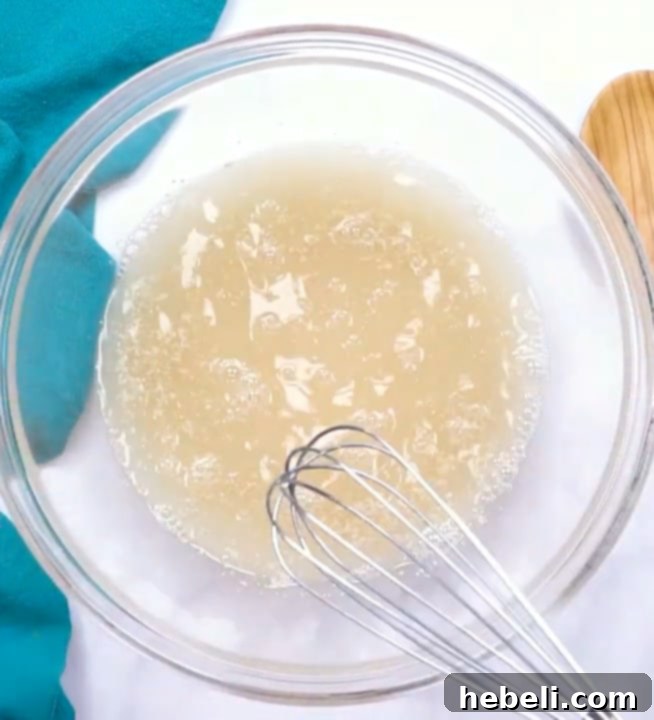 Pillowy Homemade Beignets 4 Mixing the yeast, water, and sugar to activate the yeast.